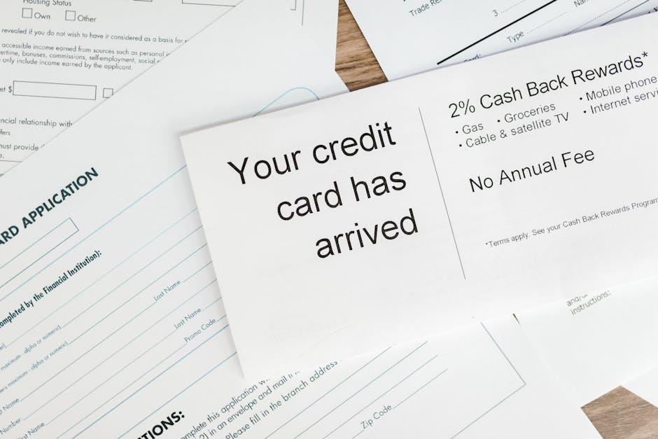 Close-up of a letter announcing the arrival of a credit card amidst financial do