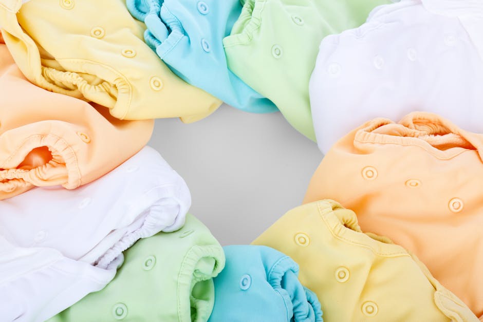 A top-view of colorful cloth diapers arranged in a circular pattern showcasing v