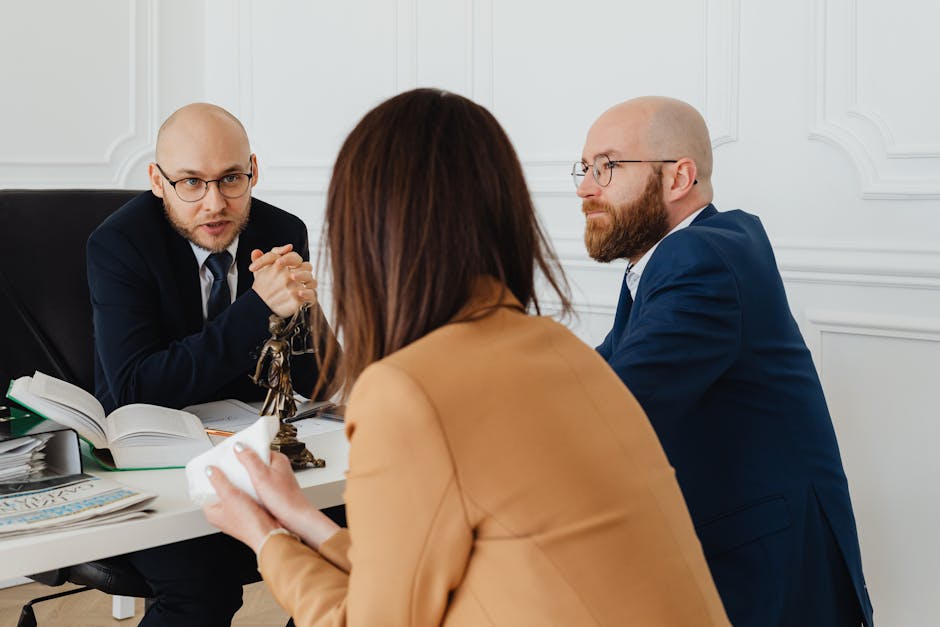 Professional discussion among lawyers in a modern office, focusing on legal matt