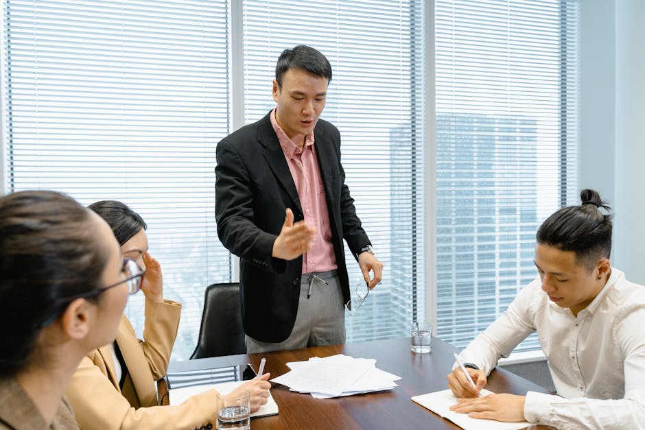 Business professionals discussing strategy during a corporate meeting in a moder