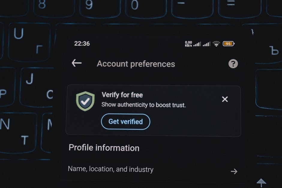 Close-up of a smartphone screen displaying account verification alert. Ideal for