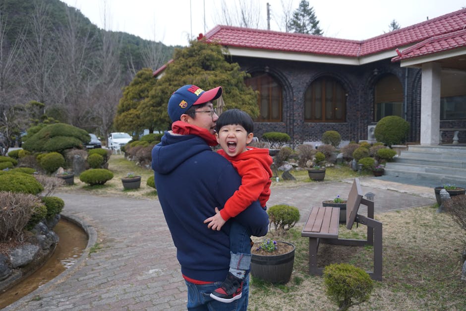 A happy father and son bonding in a lush Korean garden in Pyeongchang, South Kor