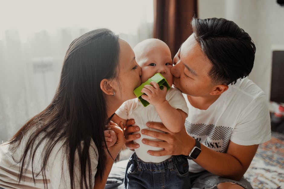 A joyful family scene with parents affectionately kissing their baby indoors, sh
